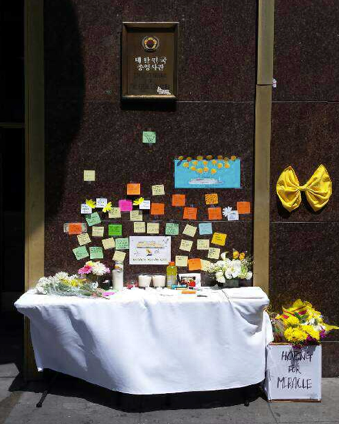Figure 1: A photo of a memorial altar set in front of the South Korean Consulate in Los Angeles